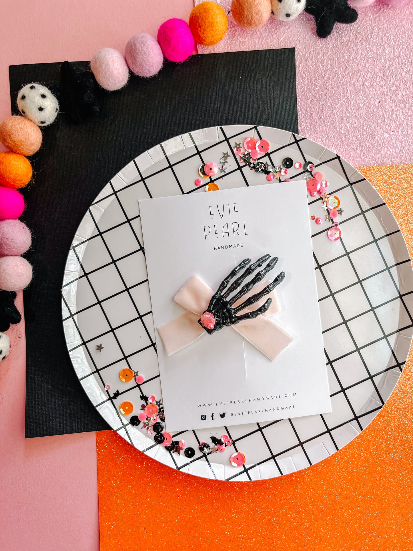 Spooky black skelly hand light pink bow
