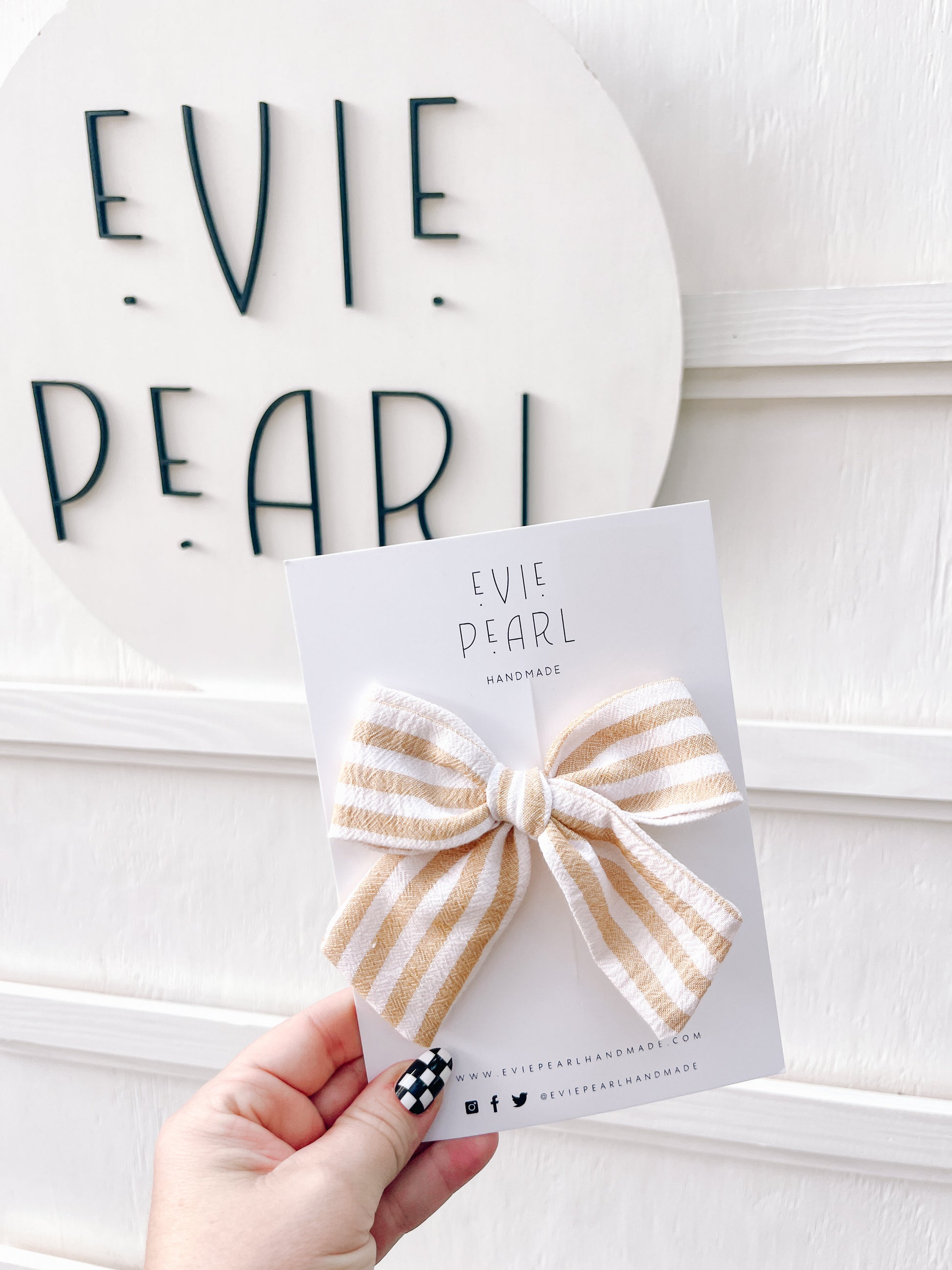 Close-up of cream and yellow striped large pinwheel bow 4 x 5 inches with secure alligator clip
