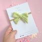Small Lime Knit Pinwheel On Nylon Headband