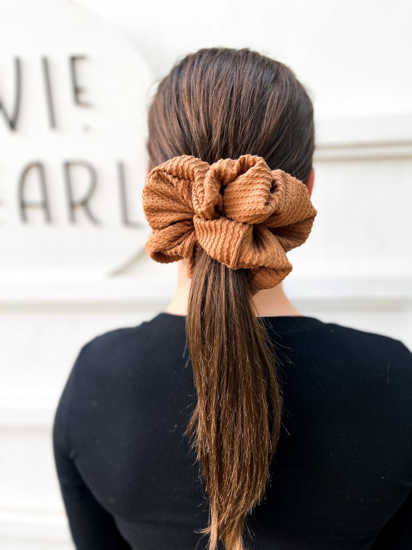 Close-up of chestnut brown ribbed scrunchie – available in regular and oversized sizes for women and girls