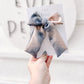 Fall neutral tiedye longtailed bow handmade gray and black hair accessory with right-side alligator clip