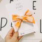 Medium Orange Checkered Swim Pinwheel Bow