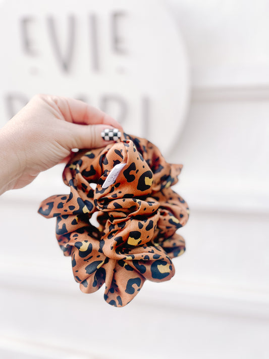 Silk leopard scrunchie in regular and oversized sizes – satin animal print hair accessory for women, teens, and girls