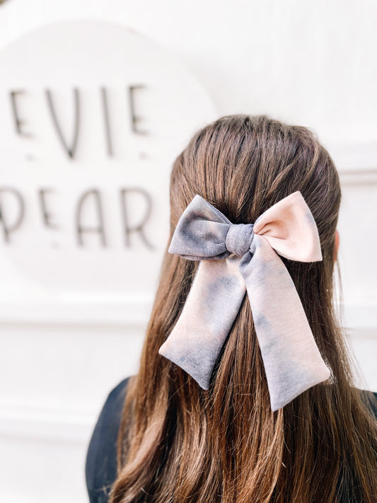 Girl wearing fall neutral tiedye longtailed bow autumn gray and black hair accessory for toddlers and women
