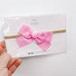 Pink Gingham Bow on nylon headband
