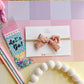 Small Floral Pink Crinkle Pinwheel on Nylon Headband