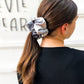 Oversized neutral tie-dye scrunchie styled in ponytail – soft beige and cream hair tie for all ages