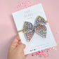 Small Multi. Mini Daisy Bow On Nylon Headband