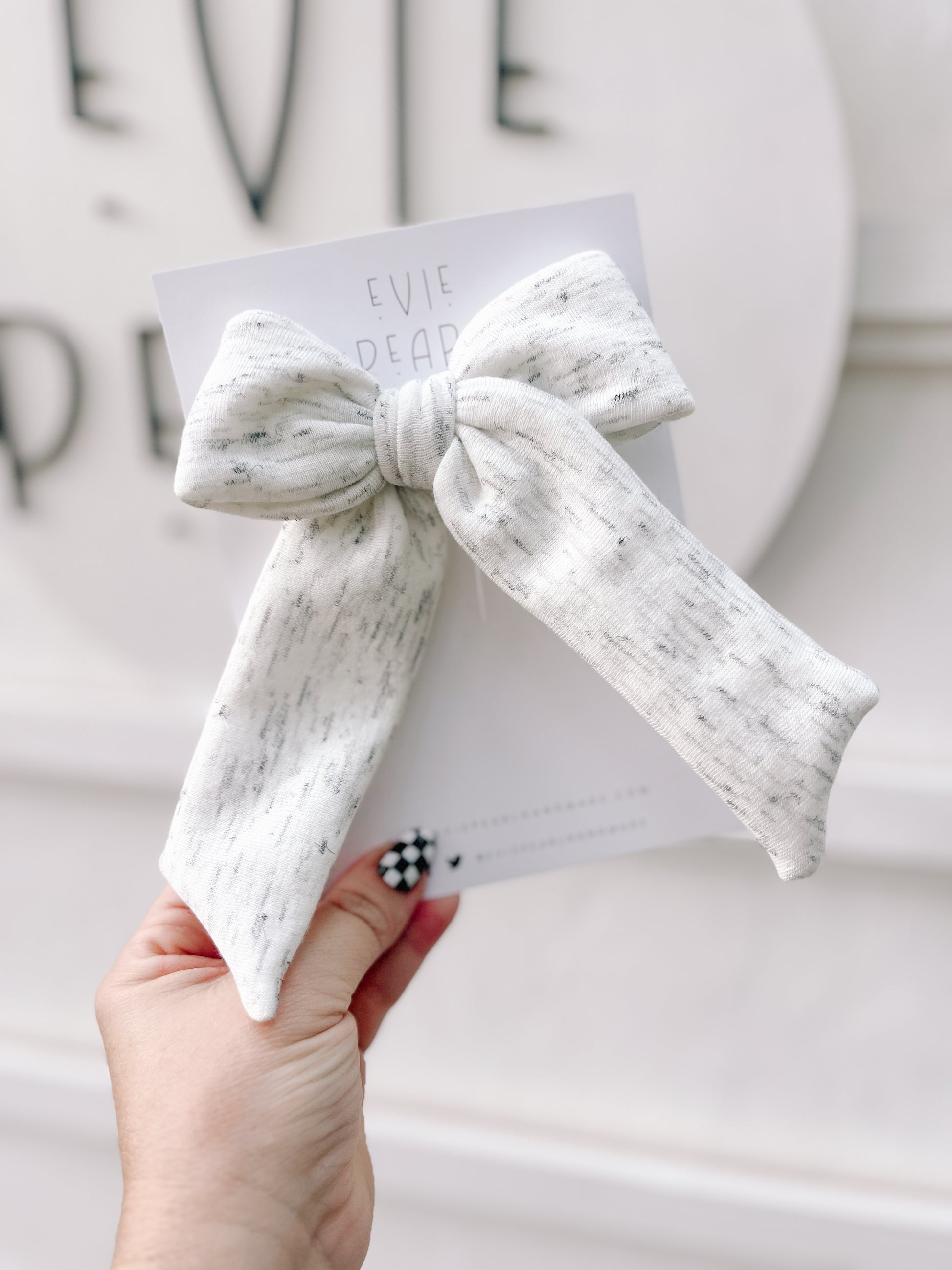 Gray sweatshirt long-tailed bow handmade neutral hair accessory with soft sweatshirt texture and right side alligator clip