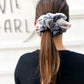 Oversized neutral tie-dye scrunchie styled in ponytail – soft beige and cream hair tie for all ages