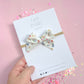 Small White Floral Pinwheel on Nylon Headband