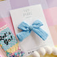 Medium Light Blue Muslin Pinwheel Bow