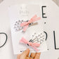 White Skelly Pigtails With Light Pink Bow