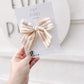 Cream and yellow striped large pinwheel bow: handmade fall neutral hair accessory with right-side alligator clip