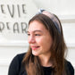 Teen wearing neutral beige and cream tie-dye knotted headband – soft handmade hair accessory for all ages