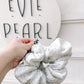 Oversized gray sweatshirt scrunchie styled in messy bun – cozy handmade hair tie for all ages