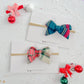 Christmas Plaid Small Pinwheel Bows on nylon headband for babies