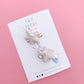 White sequin star tinsel pigtail clip set